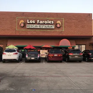 cars parked in front of a mexican restaurant