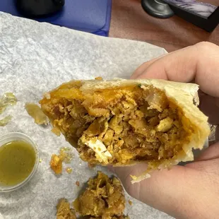 Chorizo breakfast burrito with eggshells in it