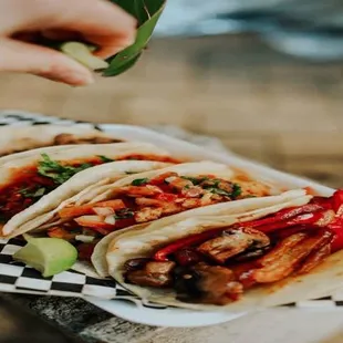 a person holding a plate of food