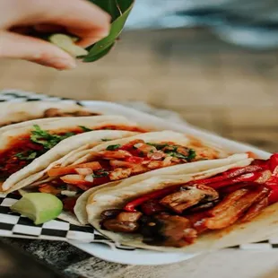 a person holding a plate of food