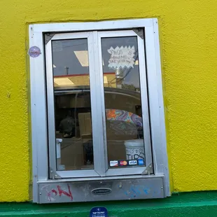 a window with graffiti on it