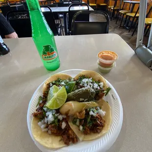 four pastor tacos and a grapefruit jarritos. $12 for all this.