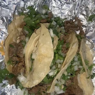Carne asada tacos with onions and cilantro
