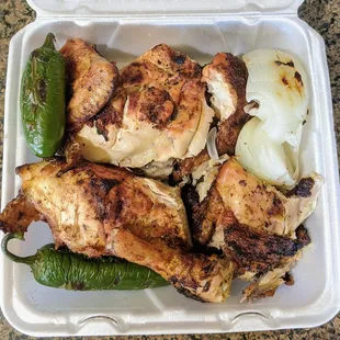 chicken and peppers in a styrofoam container