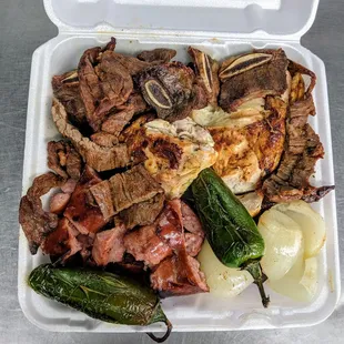 Plato Mixto de Carne Y Pollo Asado para 2 personas. Mix plate includes , Fajita, Beef Ribs, Sausage and Grilled Chicken for 2 people.