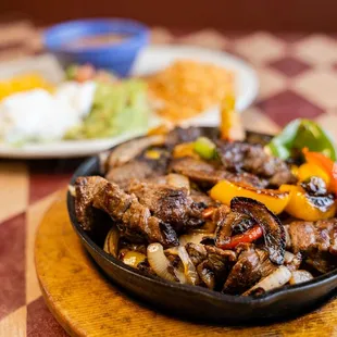 a plate of steak and vegetables
