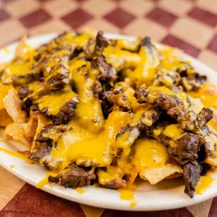 a plate of nachos on a checkered table