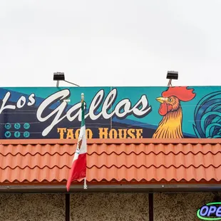 a sign on the roof of a restaurant