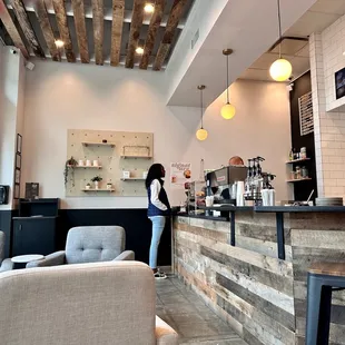 a woman standing at the bar