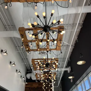 Love the wooden pallet light fixtures!
