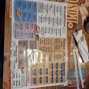 a menu on a wooden table
