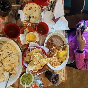 two person lunch. Chips, salsa, queso, chicken and cheese enchilada, quesadilla