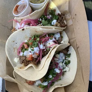 three tacoss in a basket