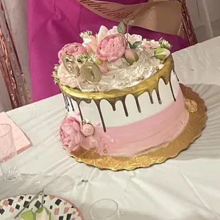 a woman decorating a cake