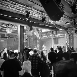 a black and white photo of a crowd of people