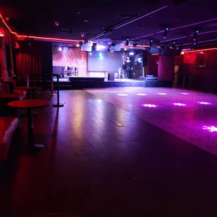 a dance floor with purple lights