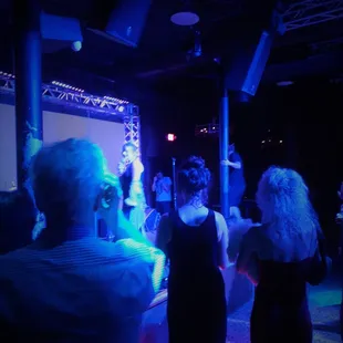 a group of people dancing at a party