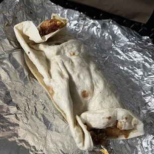 Cold breakfast burrito that is poorly wrapped