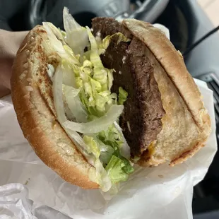  hand holding a hamburger