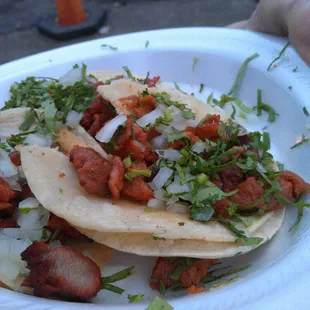 Three al pastor tacos