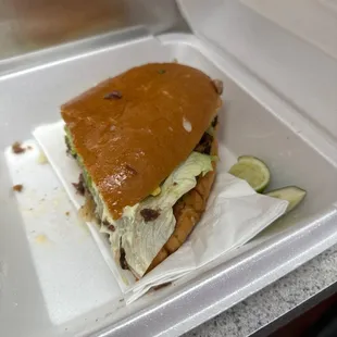 a sandwich in a styrofoam container