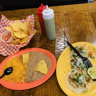 One Steak Taco, One Chicken Taco, One Pastor Taco, Side if beans and rice, Pico and Chips, and a Bottle of Water 20 bucks!!!