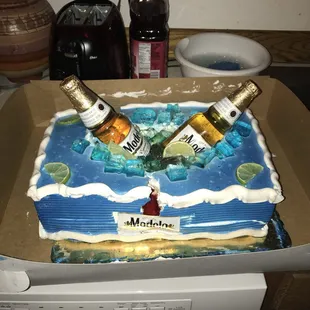 two bottles of marmel on a cake