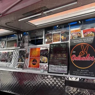 a food truck with various menus