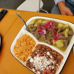 Steak Salsa Verde Y Papas. Served with rice and beans.