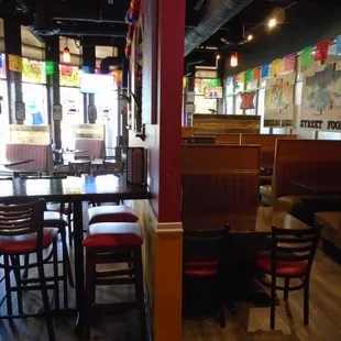The main dining room, looking towards the front windows from the back hallway.