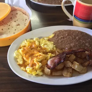 Nom nom nom. Huevos rancheros, my style, which basically means scrambled lol