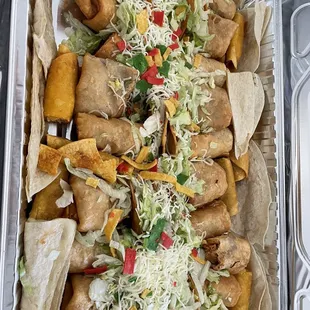 a tray of tacos and chips