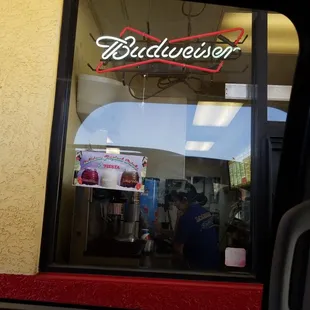a view of a budweiser&apos;s restaurant through the window