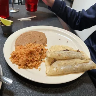 Carne asada tacos, rice and bean with homemade flour tortillas