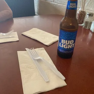 Now plastic utensils and no beer glass. Water in styrofoam cups