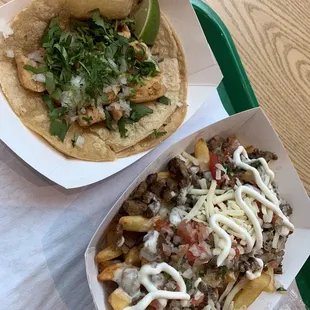 a taco and fries on a tray