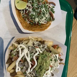two trays of food on a table