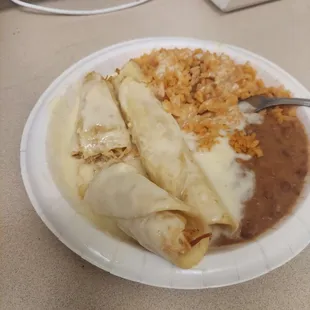 a plate of enchiladas and rice