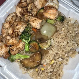 a close up of a meal in a styrofoam container