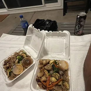 two take out containers of food