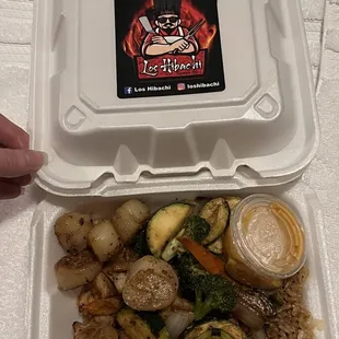 a container of food with a sticker on it