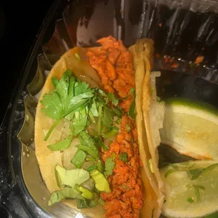 Delicious chicken taco, loaded with cilantro and onions!