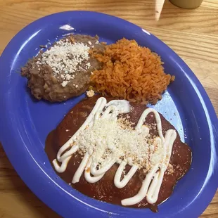 Chiles Rellenos, not very stuffed with cheese and i don't like that they put sour cream all over it