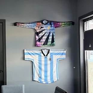 a soccer jersey hanging on the wall