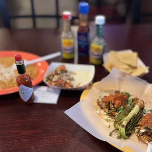 November 20, 2023 2 regular chicken tacos, side of frijoles, 2 self serve salsas and self serve warm chips.