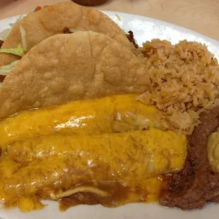 Mexican Plate - two enchiladas and two crispy tacos with a serving of rice and beans.