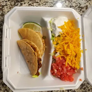 a meal in a styrofoam container