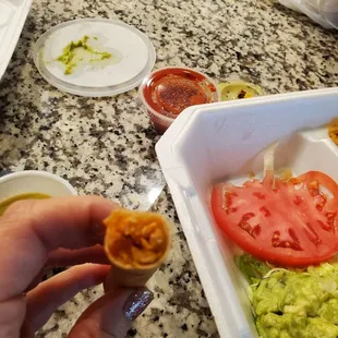 a hand holding a piece of food