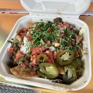 Nachos :D they use real cheese! Ask for their HOMEMADE NACHO CHIPS! They&apos;re the best!!! They also give a lot of meat too!