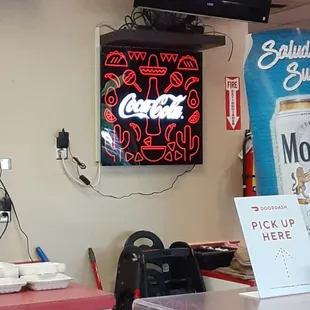 a neon sign in a restaurant